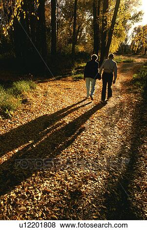 rural, couple, path, wooded, walks, elderly View Large Photo Image Stock Photo - rural, couple, path, wooded, walks, elderly. Fotosearch
