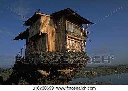 Stock Photo - sand, house, rocks, unusual, home, beach. Fotosearch
