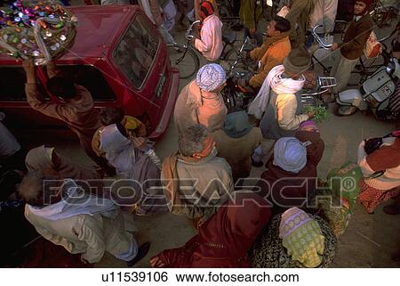 Stock Photograph - scooter, hindu, cicycles, crowd, peasant, car. Fotosearch