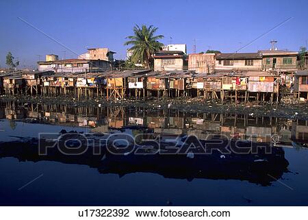 Stock Image - shacks, waterside, philippines, manila, housing, water. Fotosearch