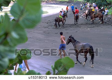 Stock Image - shore, men, riding, back, males, horse. Fotosearch