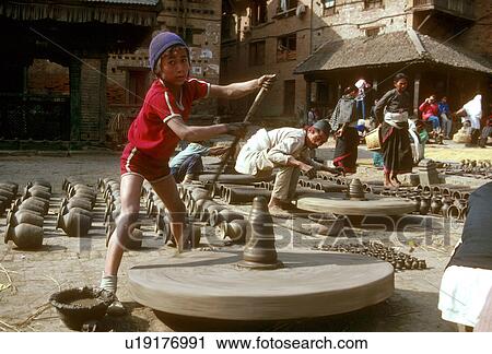 Stock Image - square, boy, potters, nepal, turnstile, 3696. Fotosearch