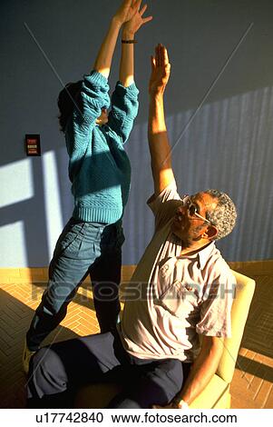 Stock Image - stretching, people, therapy, movement, fitness, medical. Fotosearch