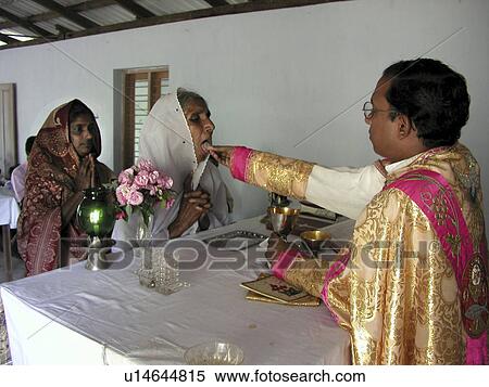 Stock Photography - sunday, person, india, supplicants, priest, people. Fotosearch