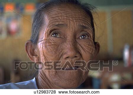 Stock Photo - town, old, stranger, ponders, female, woman. Fotosearch