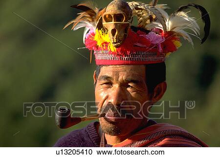 Stock Image - tribesman, monkey, headdress, shows, ifugao. Fotosearch