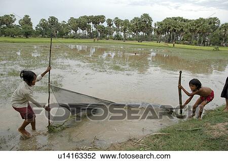 Stock Image - village, person, fishing, girls, cambodia, people. Fotosearch