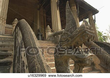 Stock Photo - wat, person, dragon, stairway, laos, people. Fotosearch