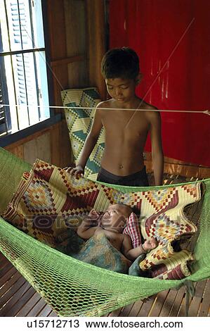 Stock Image - watching, people, boy, cambodia, person, baby. Fotosearch
