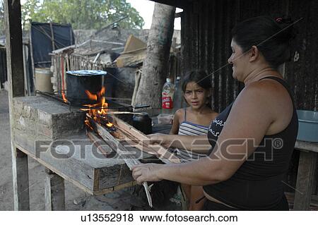 Stock Photo - wood, people, brazil, fire, person, woman. Fotosearch