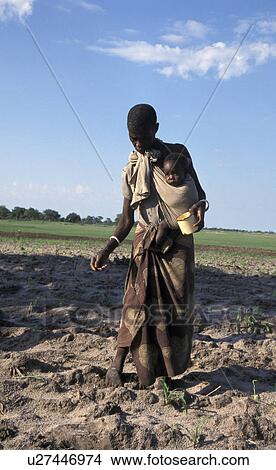 Picture - zambia, food, person, child, people, woman. Fotosearch