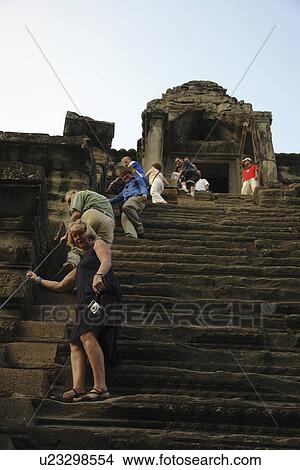 Picture - angkor, person, visiting, tourists, cambodia, people. Fotosearch