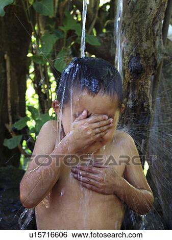Stock Photograph - bath, person, taking, boy, honduras, people. Fotosearch