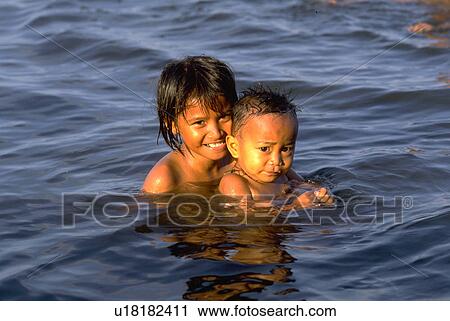 bathing, girl, brother, sister, sport, water View Large Photo Image Stock Image - bathing, girl, brother, sister, sport, water. Fotosearch