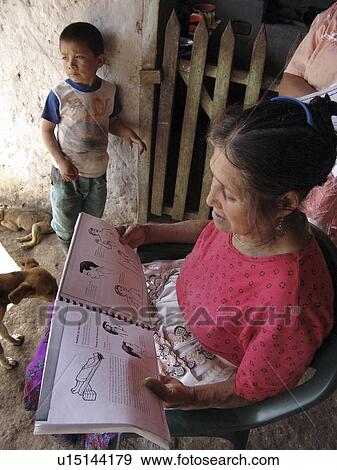 Stock Photo - book, woman, person, child, people, background. Fotosearch