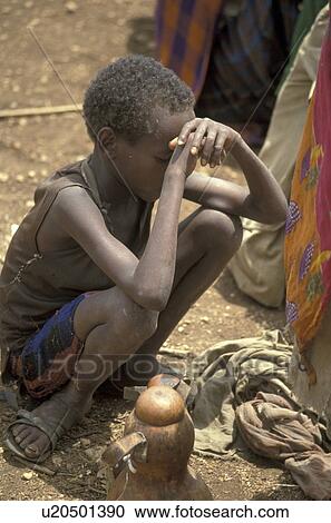 Stock Image - boy, people, hungry, ethiopia, person, food. Fotosearch