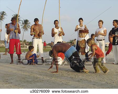 Stock Photo - capoeira, people, brazil, person, sport, beach. Fotosearch