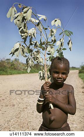 Picture - carrying, girl, zambia, person, fitness, people. Fotosearch