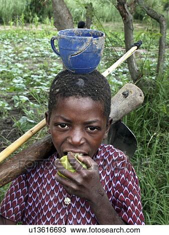 Stock Image - carrying, person, kasisi, boy, zambia, people. Fotosearch