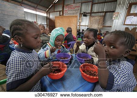 Stock Photo - children, food, person, child, people, background. Fotosearch