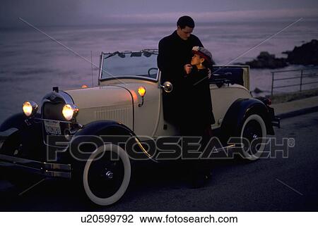 Stock Image - couple, beach, people, love, car, woman. Fotosearch