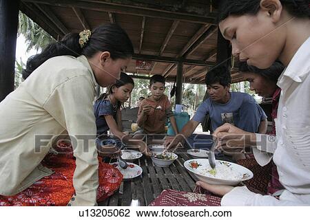 Stock Image - day, food, cambodia, person, people, family. Fotosearch