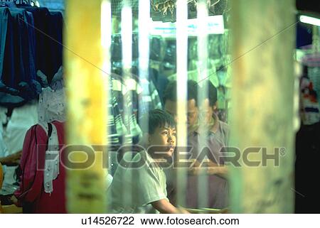 Stock Image - district, mirror, garmet, commercial, shop, boy. Fotosearch