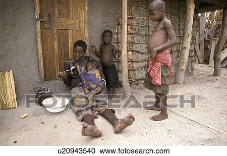 Stock Image - eating, people, zambia, children, person, woman. Fotosearch