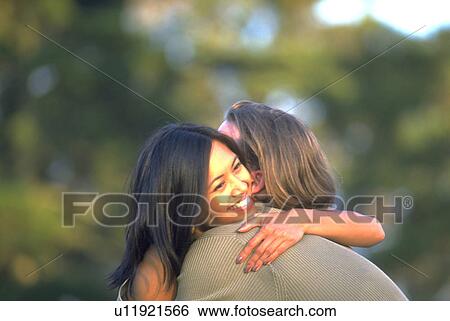 embrace, couple, hug, warm, enjoy, love View Large Photo Image Stock Photograph - embrace, couple, hug, warm, enjoy, love. Fotosearch