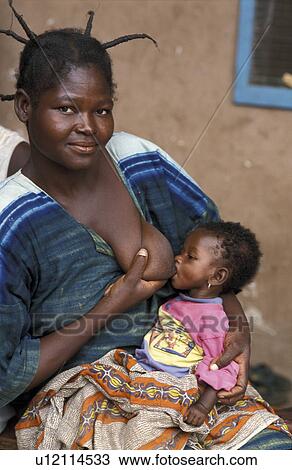 Stock Image - feeding, baby, ghana, person, people, woman. Fotosearch