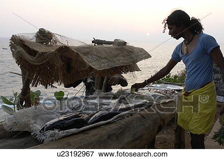Stock Photo - fresh, people, india, fish, person, beach. Fotosearch