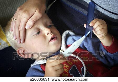 Stock Image - head, kid, hands, fever, sickness, child. Fotosearch