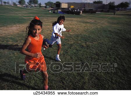 Stock Photography - hispanic, running, exhilaration, joy, playing, girls. Fotosearch