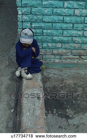 Stock Photo - hispanic, sad, mexico, lonely, crying, boy. Fotosearch