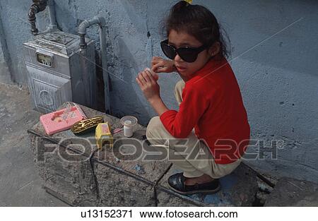 Stock Image - hispanic, wearing, playing, girl, mexican. Fotosearch