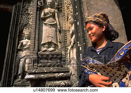 Stock Photo - holding, art, female, young, women, woman. Fotosearch
