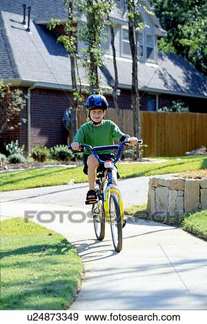 Stock Photo - images, child, bicycle, riding, kid, boy. Fotosearch