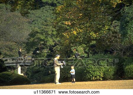 Stock Image - kid, father, garden, shinjukugyoen, child. Fotosearch