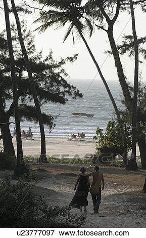 Stock Photo - leading, people, path, india, person, beach. Fotosearch