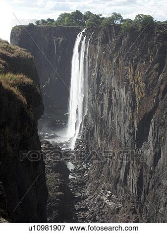 Stock Photo - livingstone, person, falls, victoria, zambia, people. Fotosearch