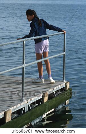 Stock Image - looking, child, pier, dock, girl. Fotosearch