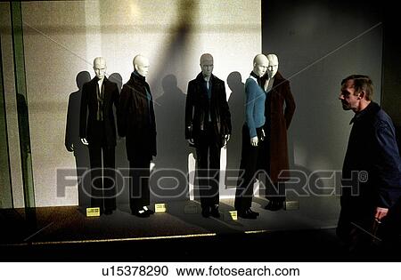 Stock Image - looking, display, front, store, male. Fotosearch