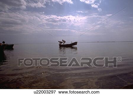 Stock Photo - males, food, men, two, fish, water. Fotosearch