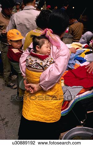 mother, carried, female, woman, back, babies View Large Photo Image Stock Image - mother, carried, female, woman, back, babies. Fotosearch