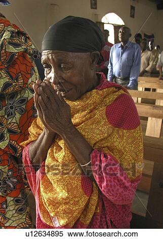 Stock Photography - mwanza, person, mass, catholic, tanzania, people. Fotosearch