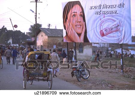 Stock Photo - peasants, billboard, commercial, bicycles, indian. Fotosearch