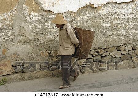 Stock Photo - person, carrying, male, china, people. Fotosearch