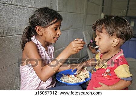 Stock Image - person, people, child, girl, hand, food. Fotosearch