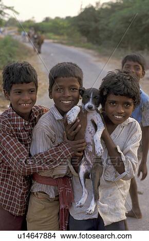 Picture - person, puppy, boys, india, people. Fotosearch