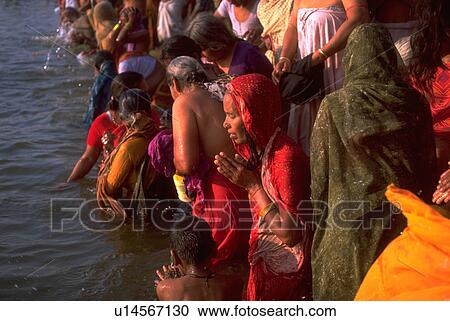 Stock Image - praying, love, bathing, hindu, people, water. Fotosearch